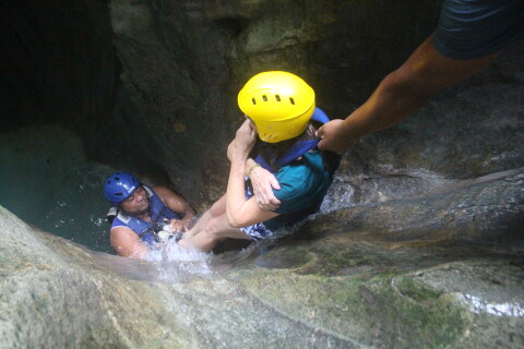 sliding down with the help of the experienced guides