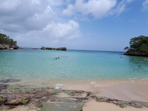 Bay of the ocean in between rocks