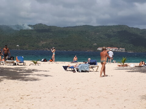 Samana beach, tourists enjoy sun