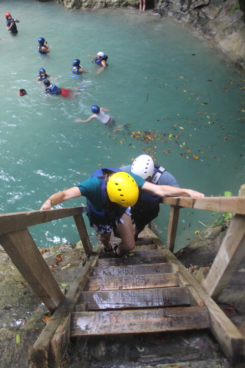 persons taking stairs down, to afraid to jump down the falls